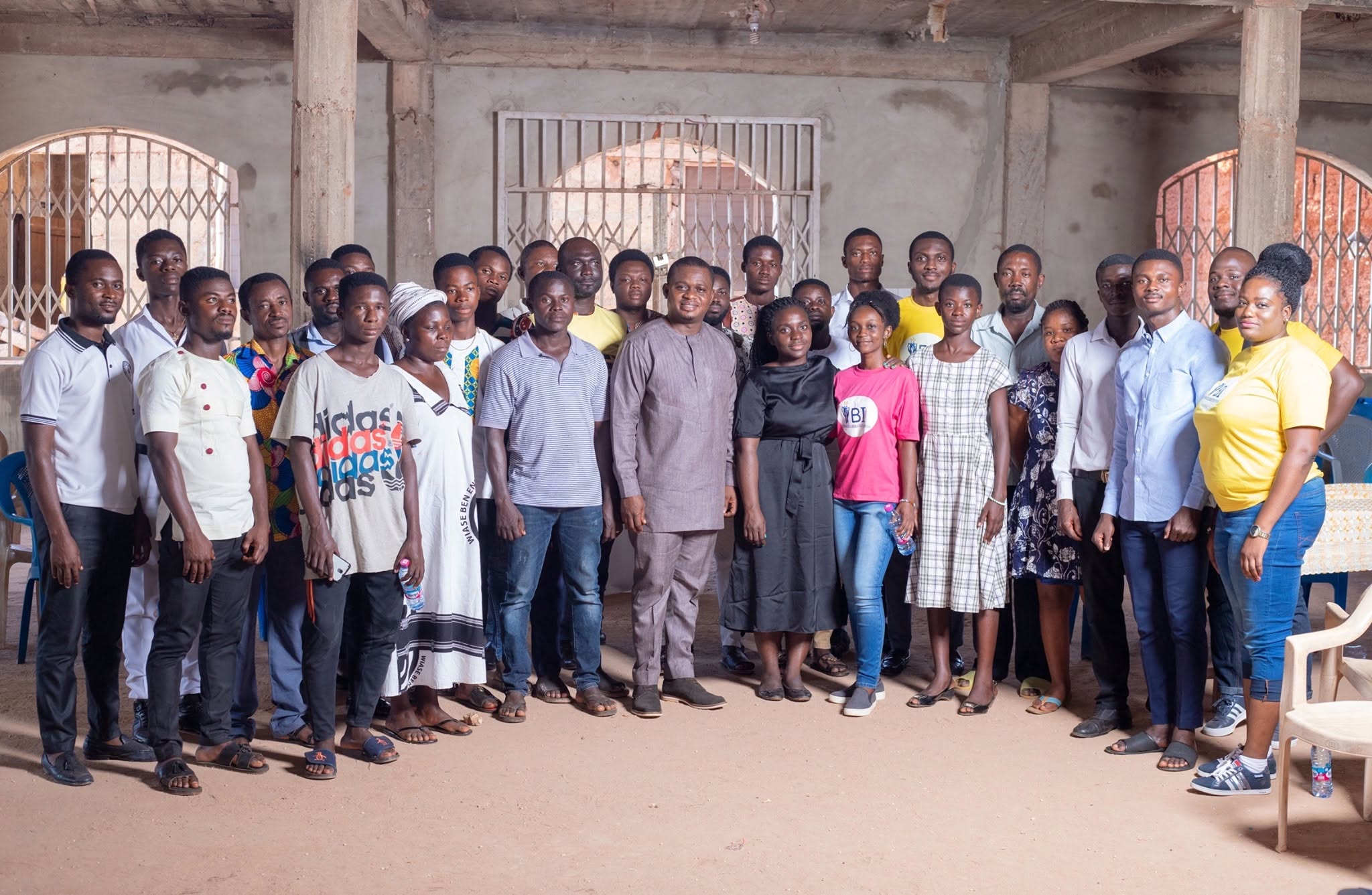 Young people, community members and ACAI facilitators gathered for a group photo after a community climate dialogue